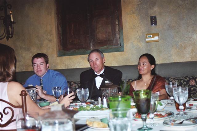 Tom`s friend Pat, Dad, and Tess enjoying the meal