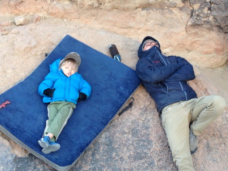 William and Cody falling asleep on the rocks in the freezing cold weather.