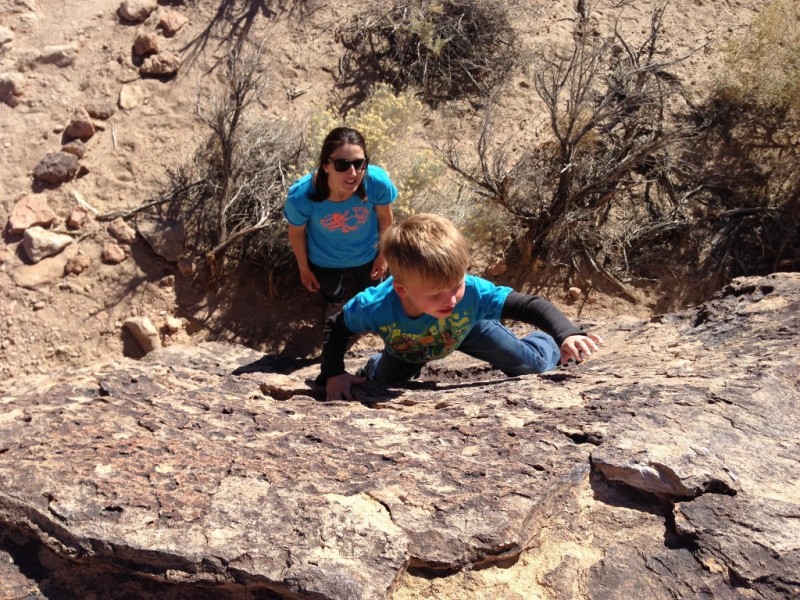 Working his way up another boulder